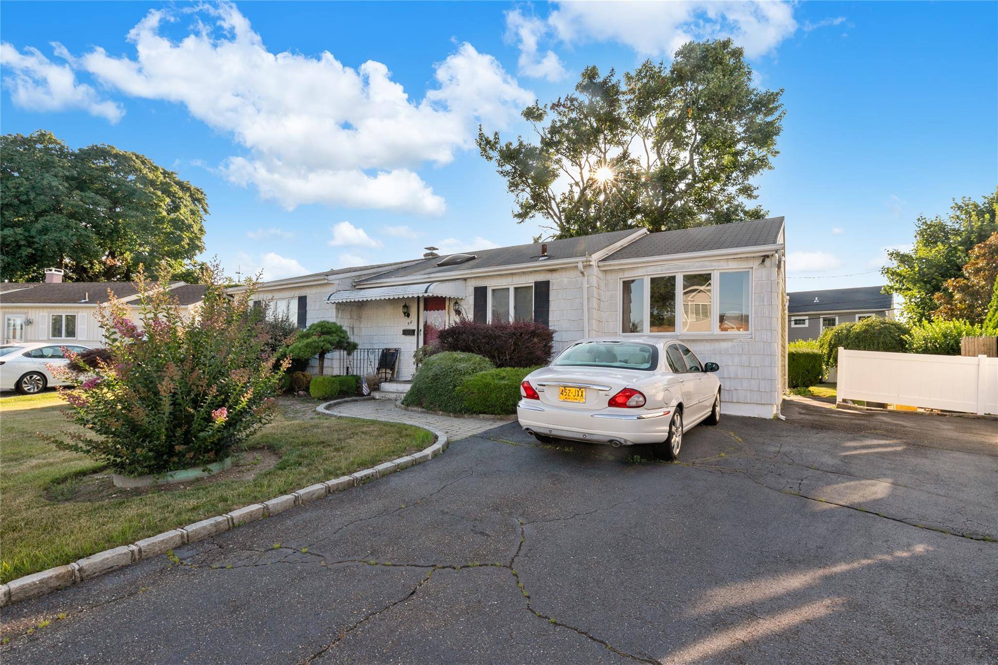 Welcome to This Sundrenched Ranch Nestled in a Desirable Mid Block Location.