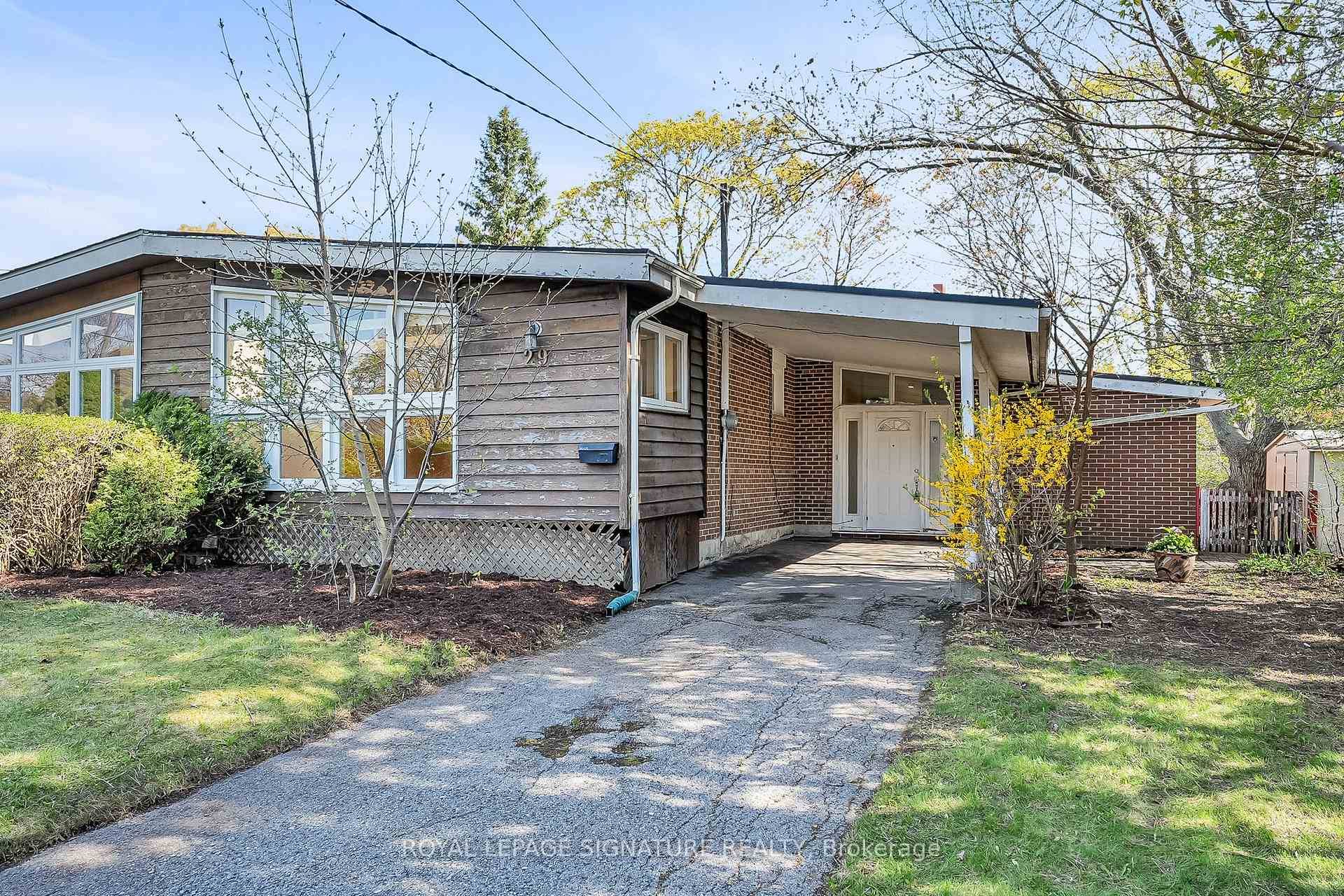 Renovators Delight ! Spacious semi detached bungalow with a family room addition and a front sun room with two skylights in a prime location just steps to schools including French ...