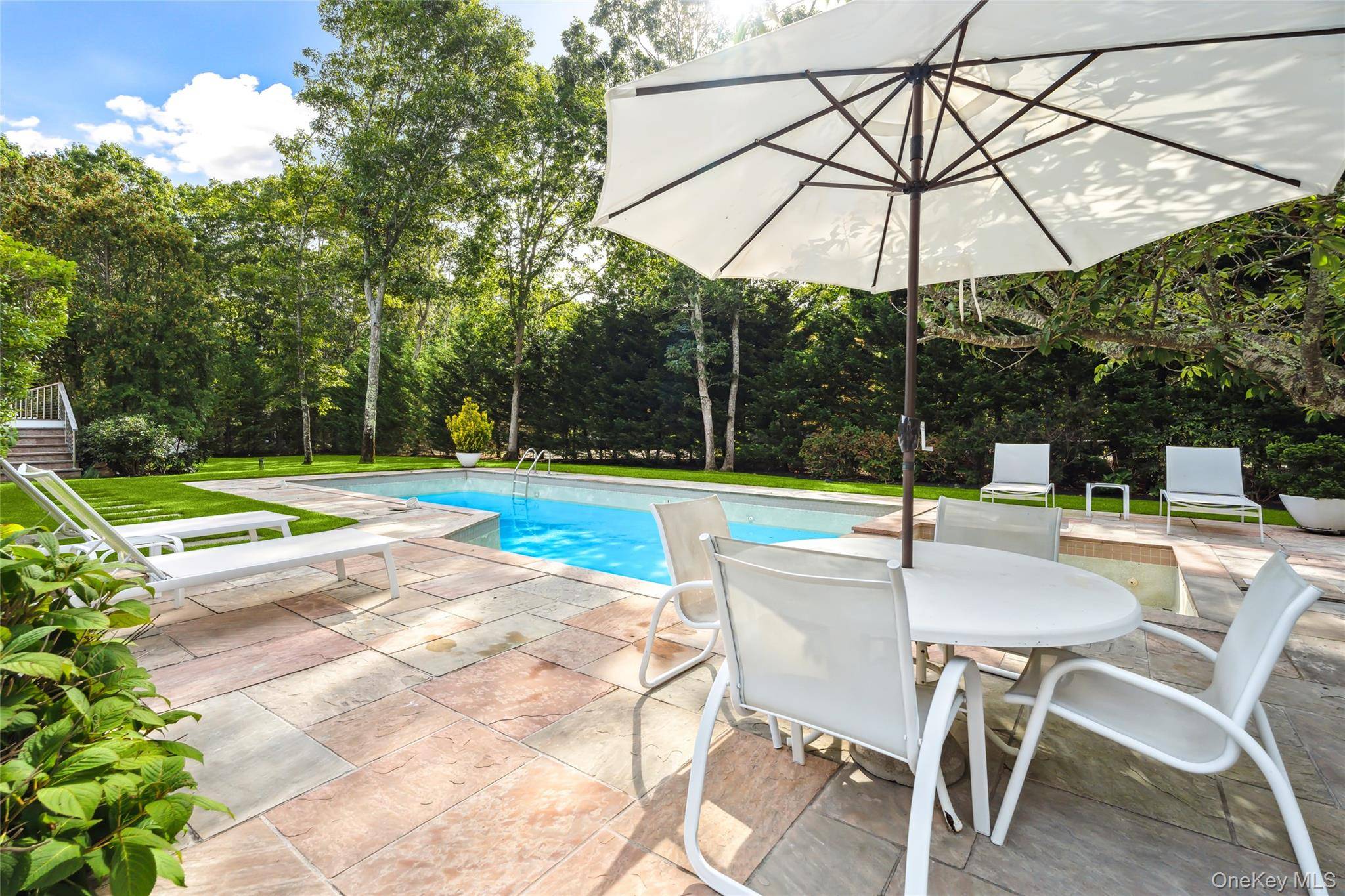 QUOGUE VILLAGE CONTEMPORARY Enjoy your vacation in this turn key 4 BR 4 BA rental compound located on a quiet street in Quogue village.