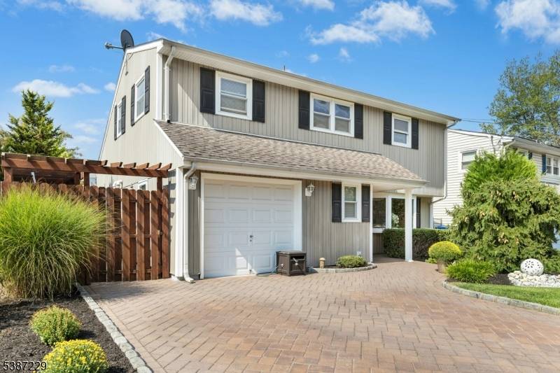 Nestled on a quiet, tree lined street in the desirable Colonia neighborhood, this beautifully customized split level home offers three bedrooms and two full bathrooms.