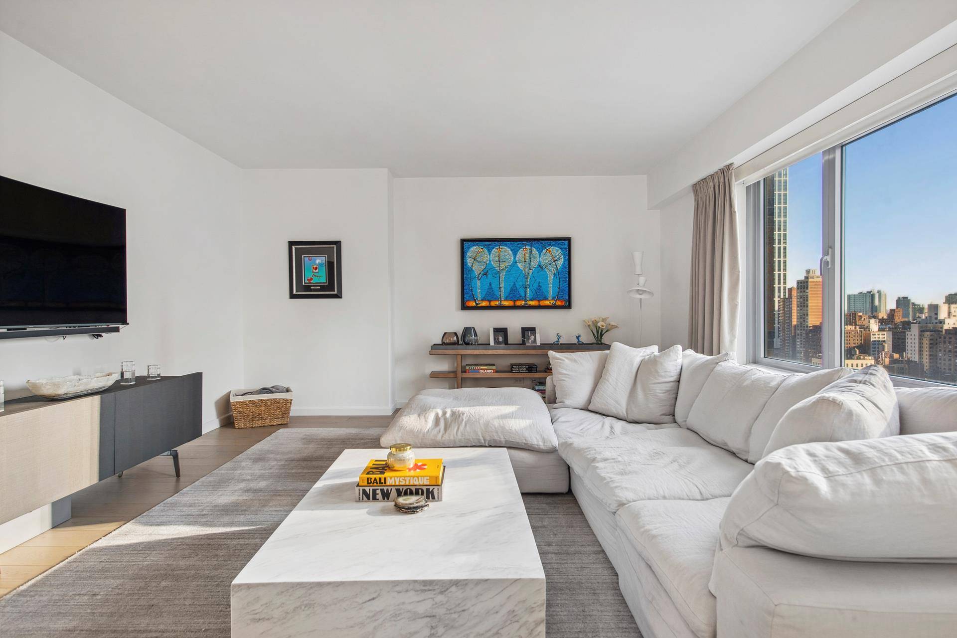 Introducing a stunning 1, 728 square foot corner residence with two bedrooms, two bathrooms, and a powder room, graced with modern, elegant interiors by Messana O'Rorke.