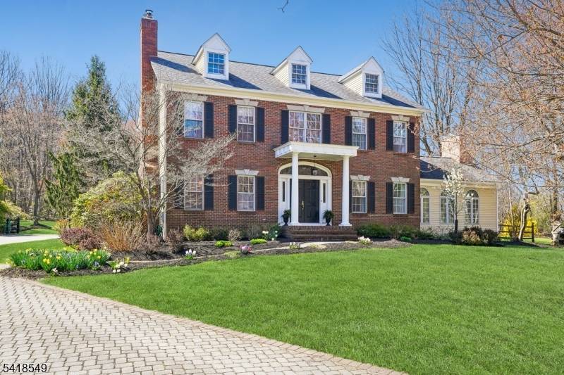 Experience the perfect blend of elegance and comfort in this custom built Federal Colonial style residence, nestled in a sought after cul de sac location.