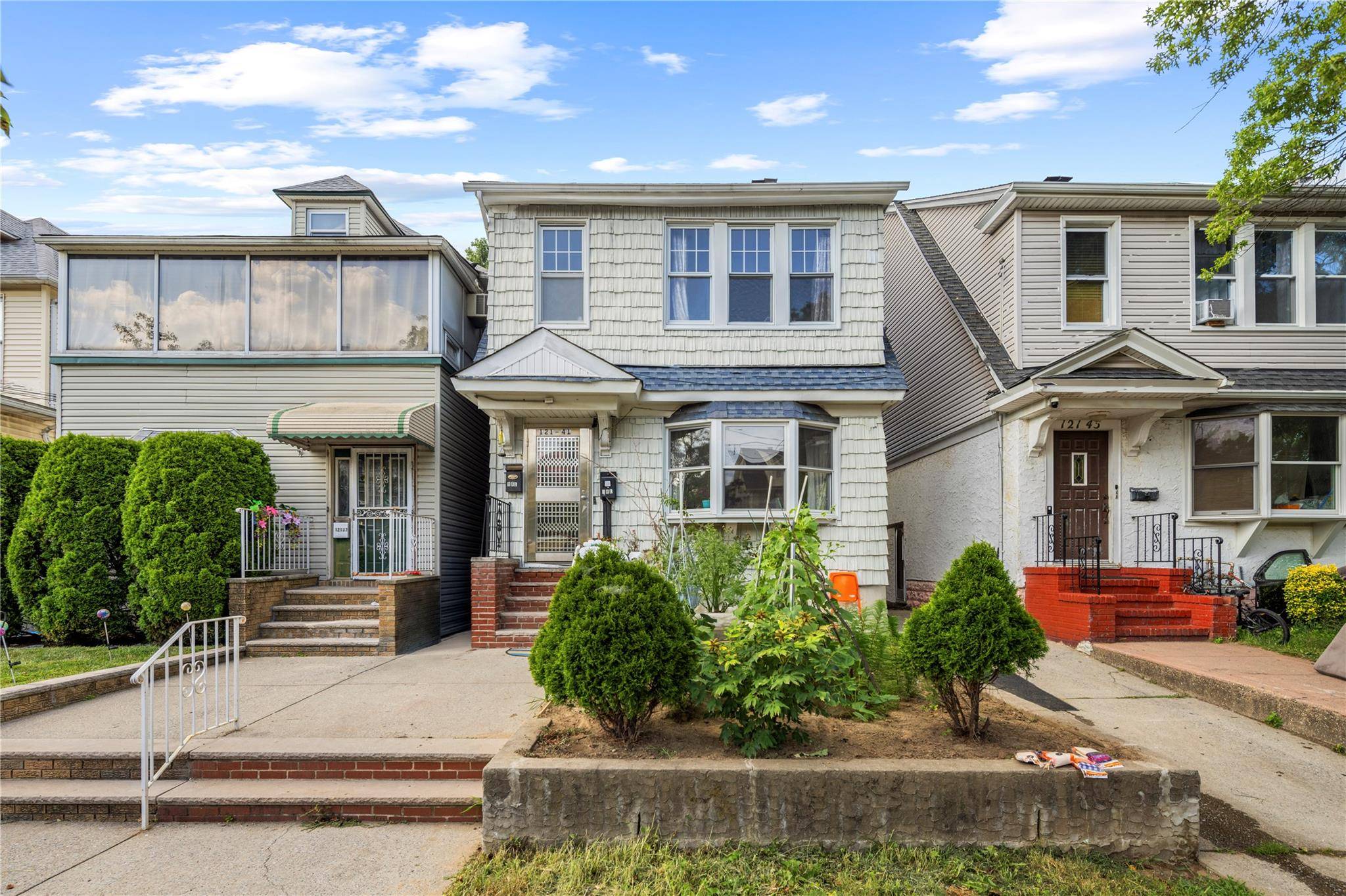 Welcome to this fully detached Colonial style legal two family home, offering a spacious and versatile layout ideal for both end users and investors.