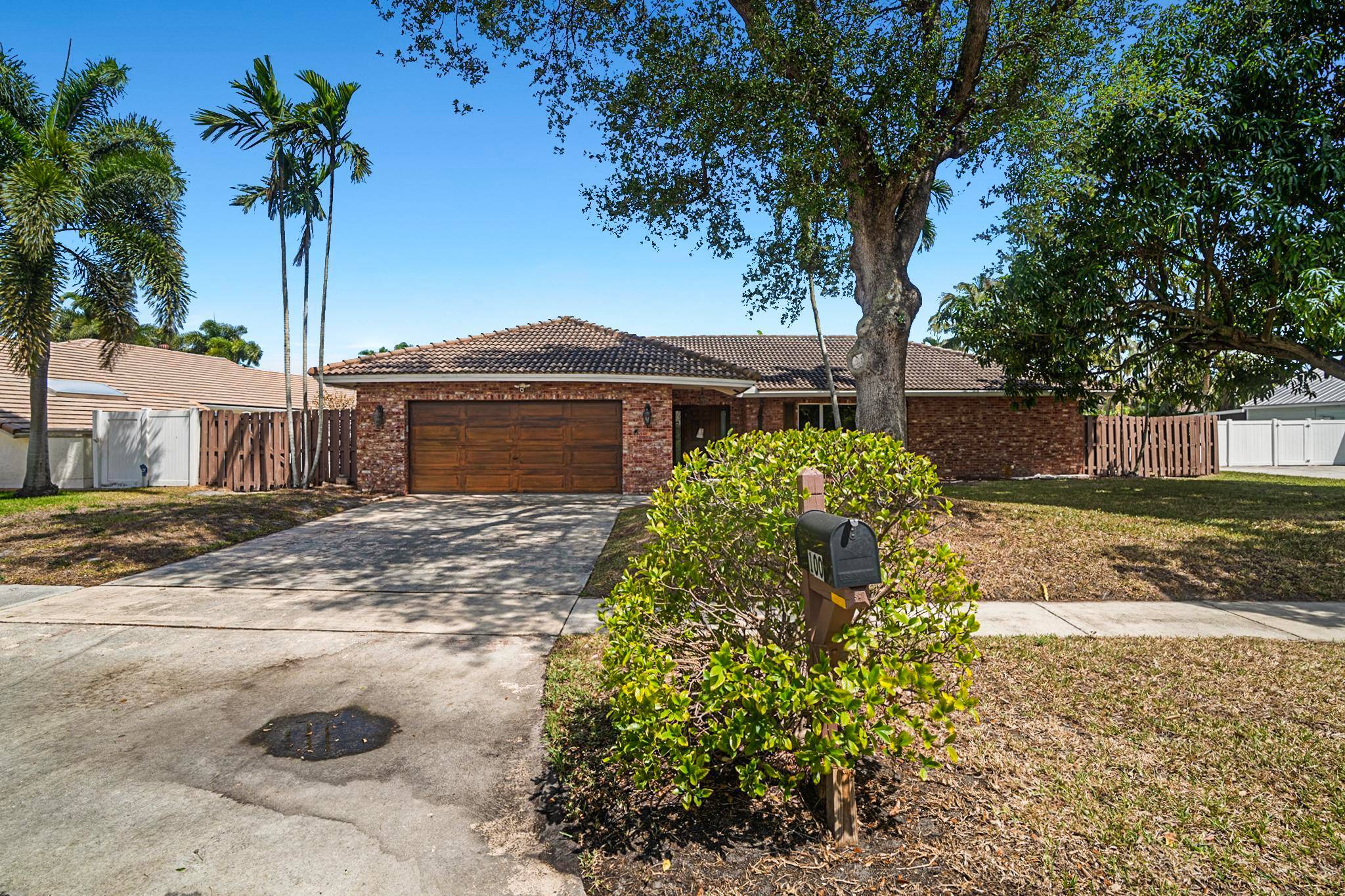 Spacious home with pool in Boca Square on large lot.