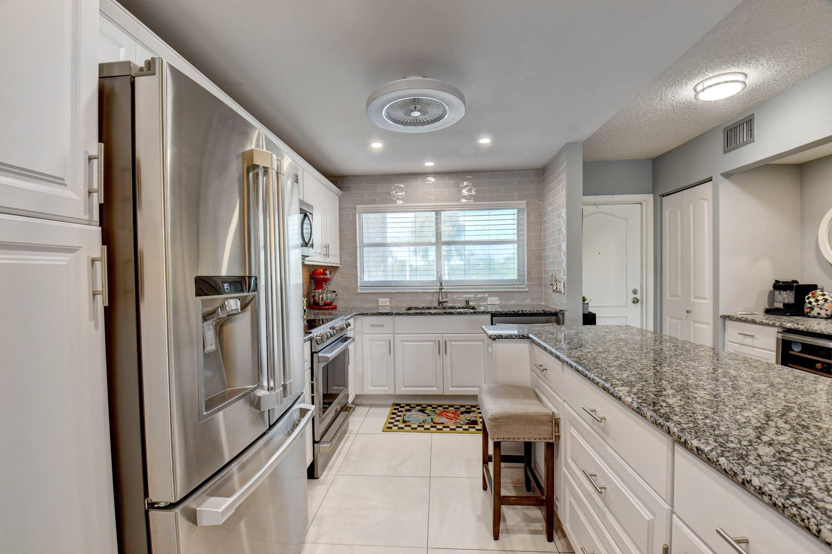 BEAUTIFULLY Renovated 2B 2B SEAGATE of Gulfstream Condominium with 2020 Impact Windows, 2020 Renovated Kitchen with Granite Countertops, Wine cooler coffee bar, 2020 Appliances, 2020 Water heater, 2020 AC and ...