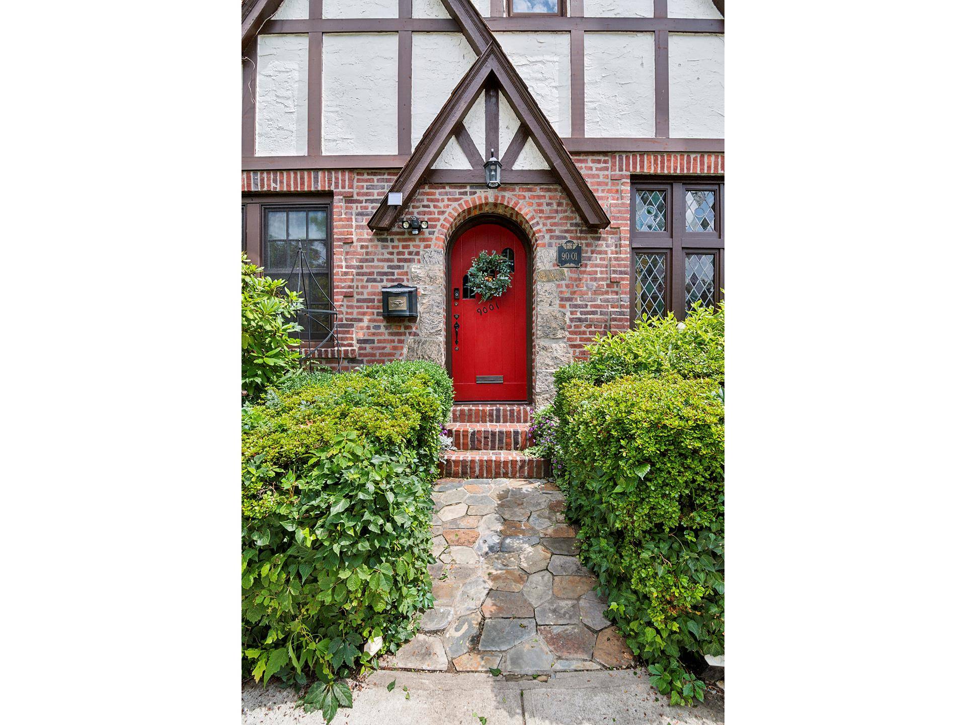 Rarely available corner Wolosoff Brothers Tudor townhome, blending timeless architectural charm with thoughtful modern upgrades.