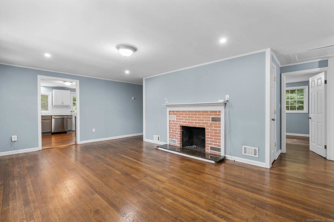 Tucked away in Guilford's sought after Westwoods neighborhood, this beautifully renovated 3 bedroom, 2 bath ranch is the perfect blend of modern updates and natural privacy.