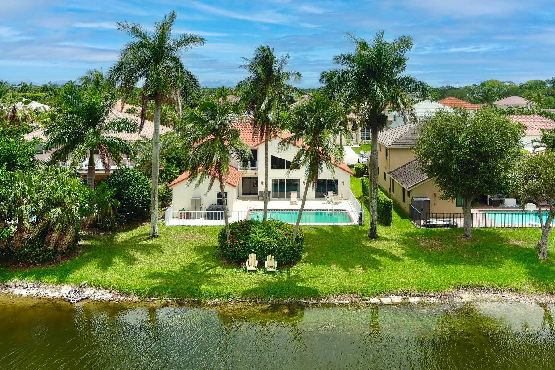 Welcome home to your stunning lakefront estate located in the highly coveted Le Paiais section of Rainbow Lakes.