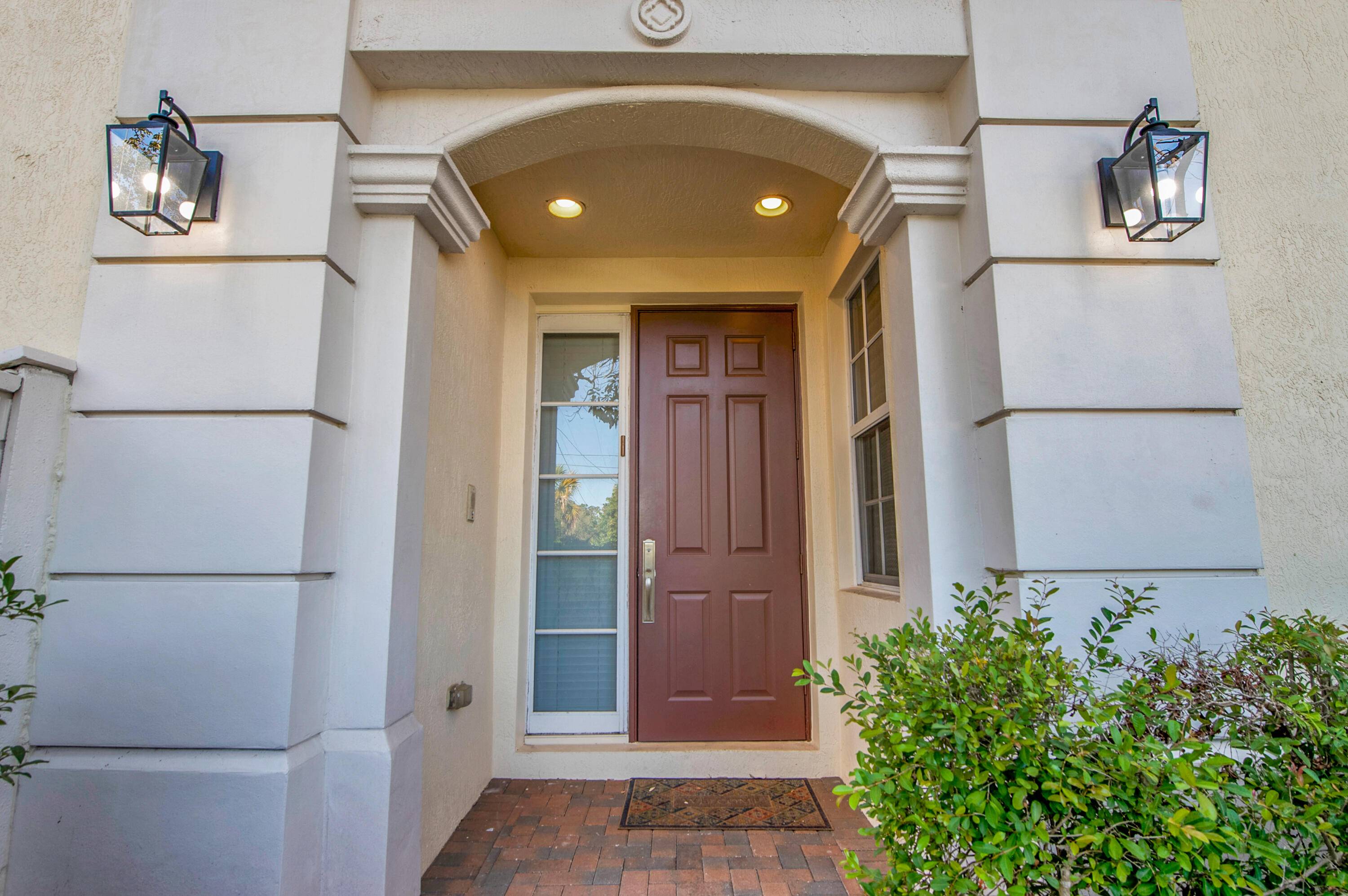 This stunning Gated three story townhouse offers 4 bedrooms, 3.
