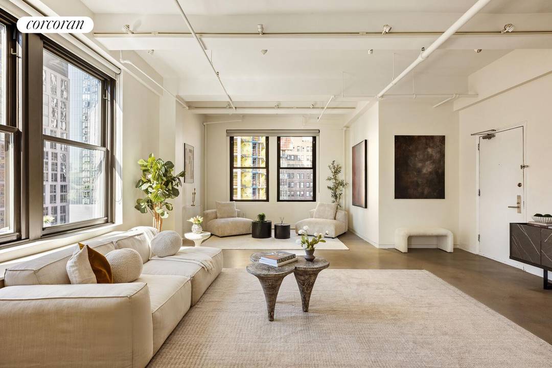 Perched on a high floor in a boutique Nomad cooperative, this designer two bedroom, two bathroom pre war loft seamlessly blends classic loft aesthetic with modern finishes.