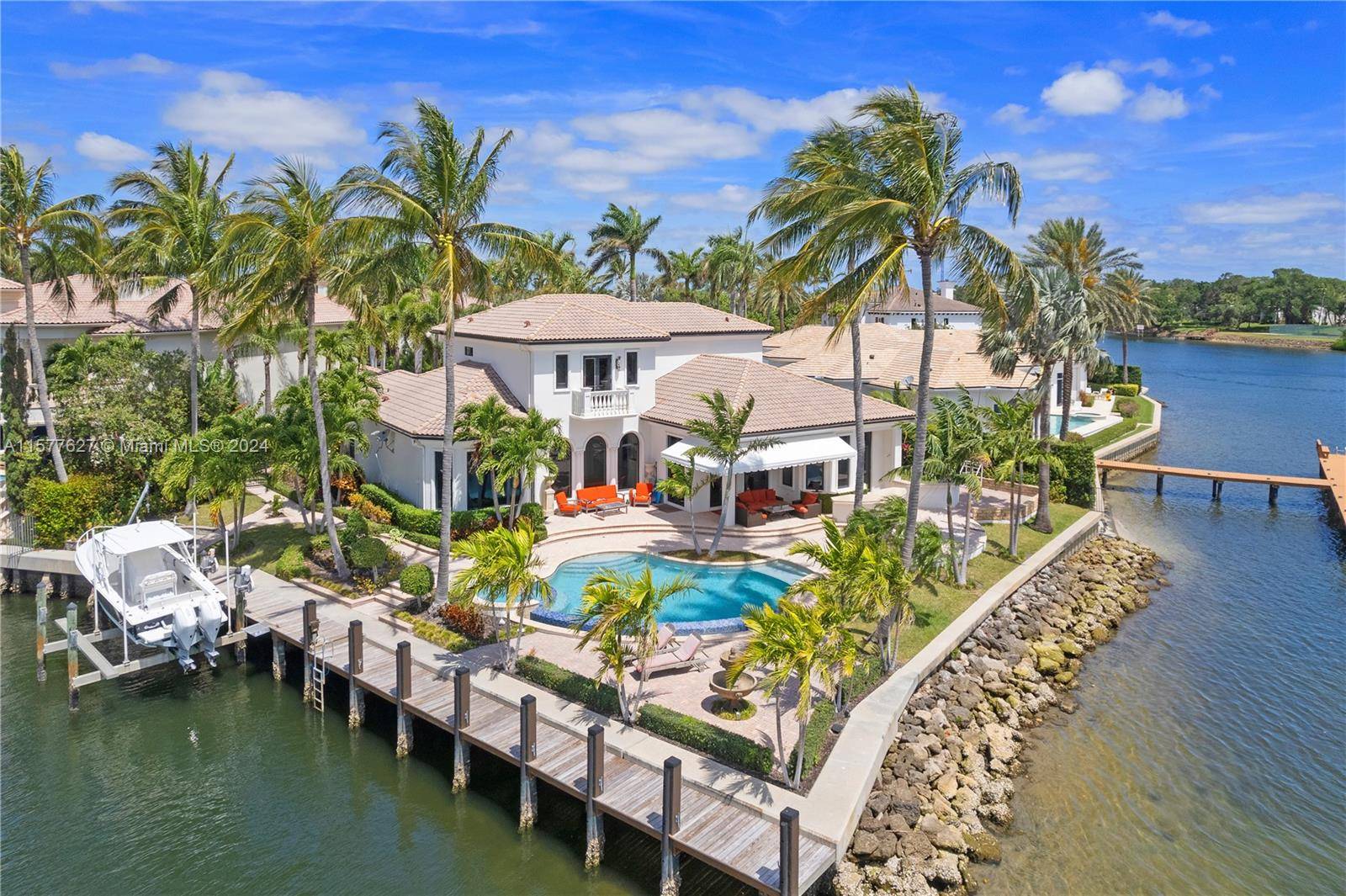 Beautiful waterfront property on a point lot with 260' of frontage and deep water dockage for up to an 80' vessel special exception for 100' TBD nestled in the prestigious ...
