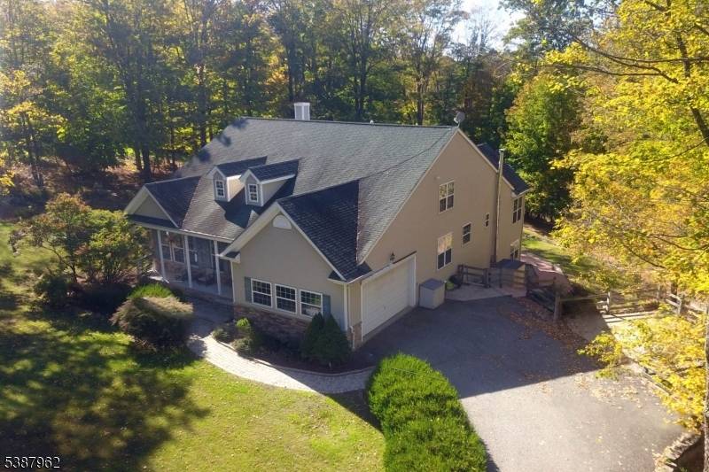 Custom Home Steps from Lake Hopatcong This spacious, custom built beauty sits just 998 feet from Lake Hopatcong close enough to stroll to the water or grab dinner at one ...