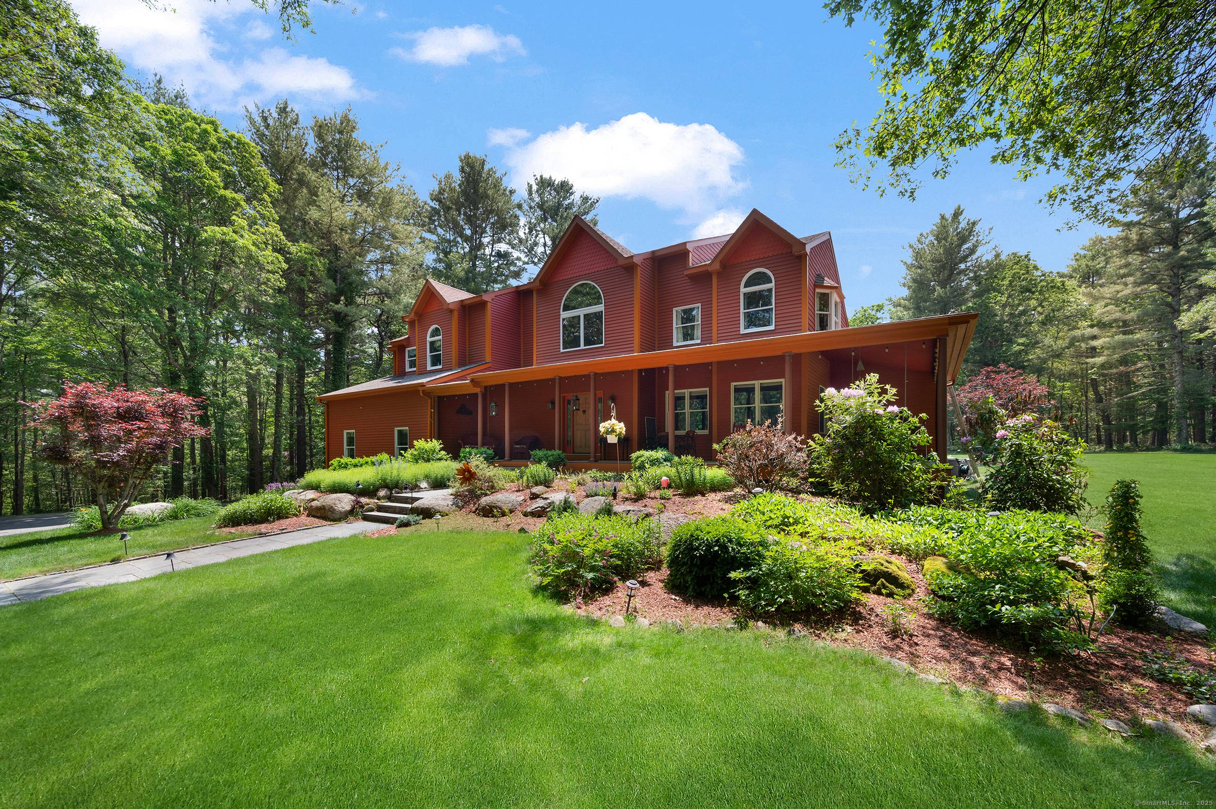 Sited on six private acres in the heart of Exeter, Rhode Island, this exceptional retreat is a nature lover's dream.