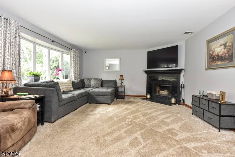 Pride of ownership abounds in this charming home set on an oversized lot in sought after Montville Township !