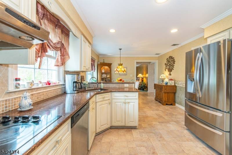 Terrific colonial with remodeled kitchen featuring granite counters and stainless steel appliances.