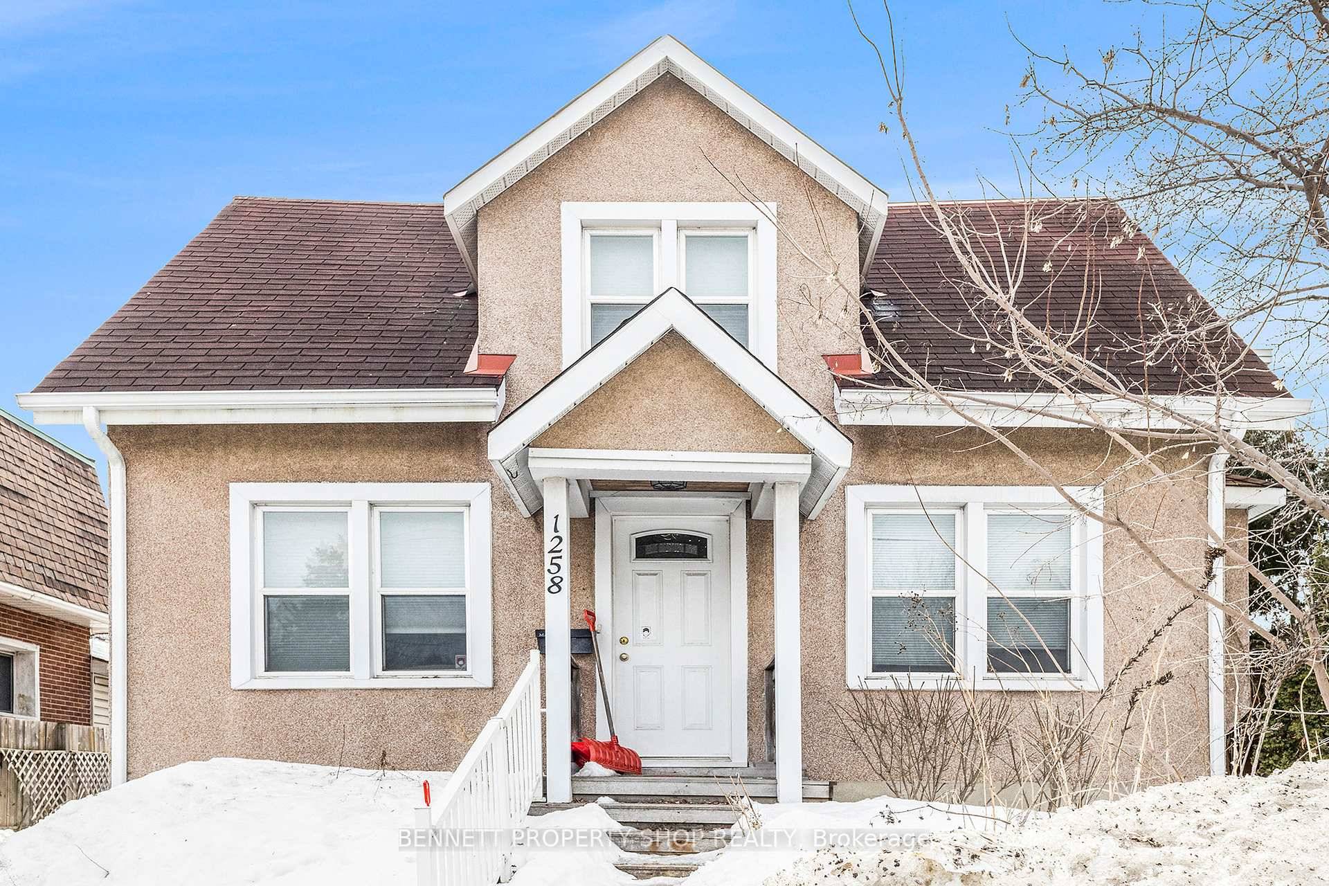 Unlock a world of potential with this charming detached bungalow at 1258 Heron Road, Ottawa, perfectly poised in the bustling Ridgemont area.