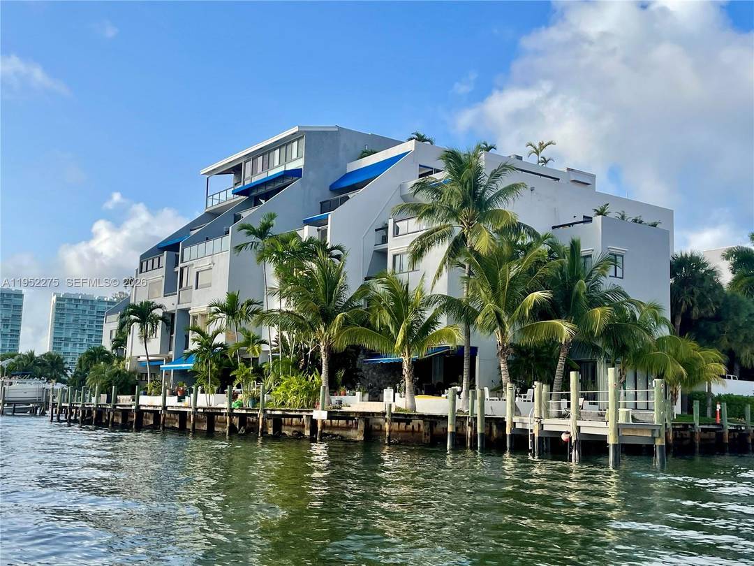 Fantastic intracoastal waterfront townhome with rare, unobstructed waterfront views in walking distance from beach.