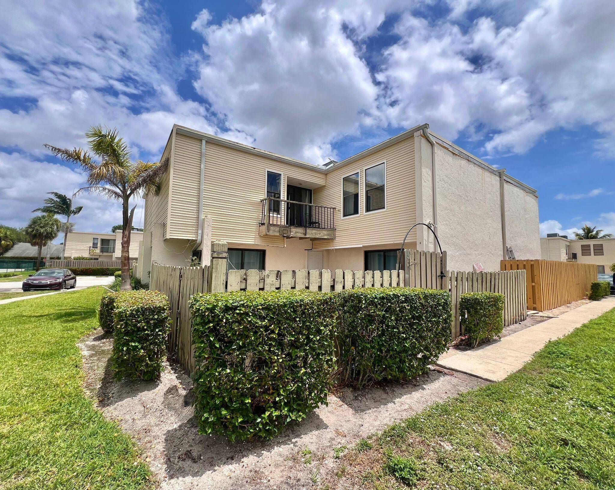 This 2 bedroom, 2. 5 bathroom spacious townhome offers great bones and tons of potential in one of Wellington's most desirable neighborhoods !