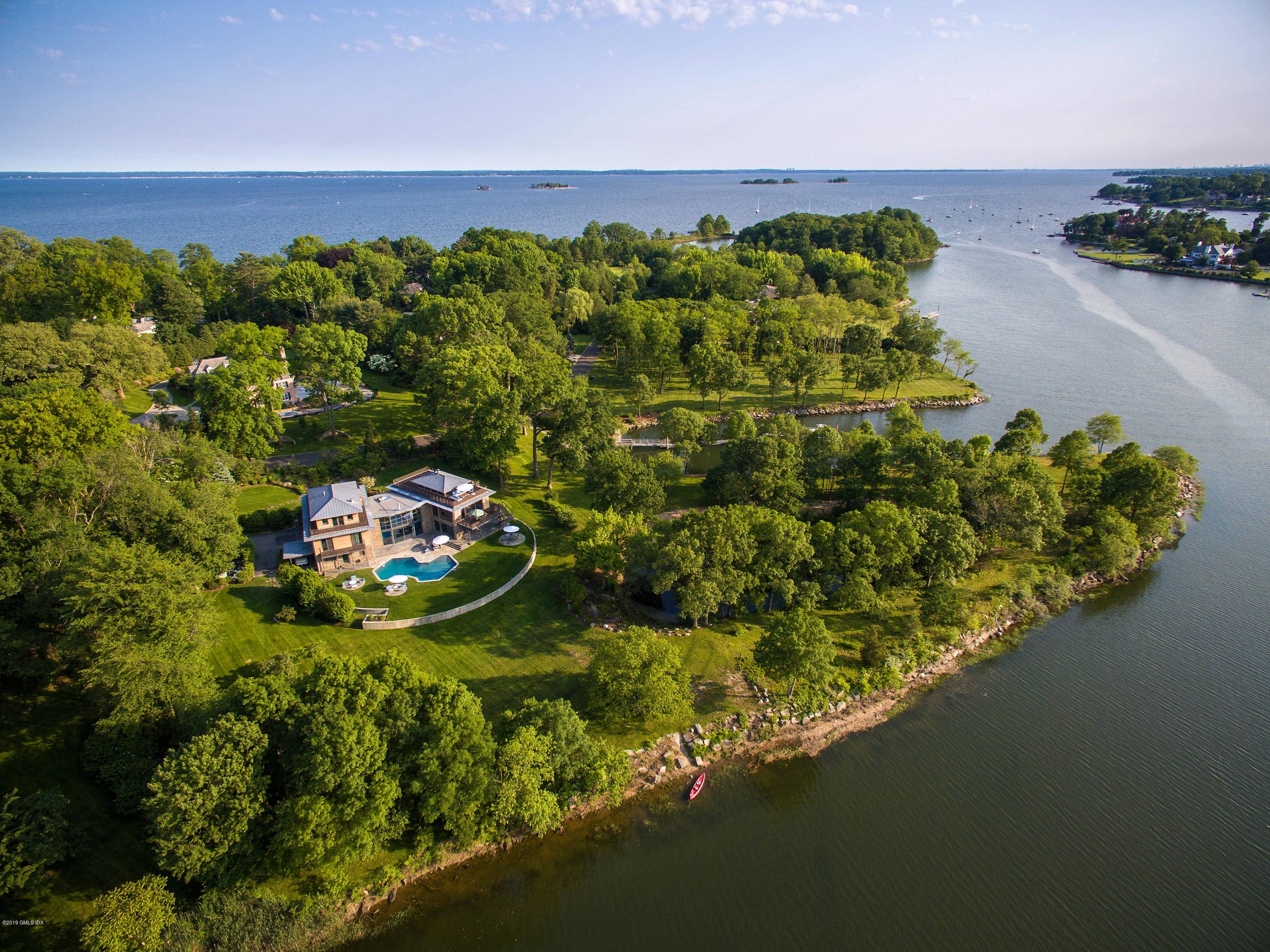 Incredible Mead Point Association waterfront custom 6 bedroom home with unmatched scenic tranquility.