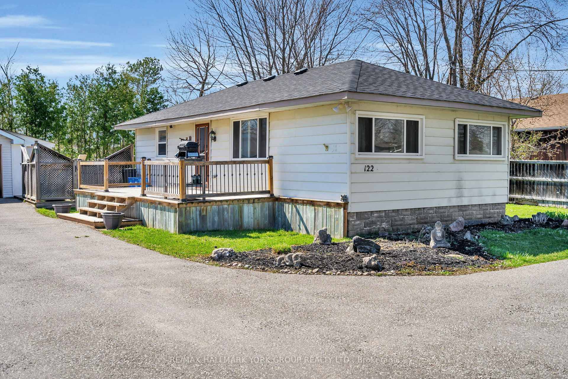 Situated in the Lakeside Community of Virginia, This Charming Year round Bungalow at 122 Sunset Beach Road Offers Peaceful Living Just Steps From Lake Simcoe.