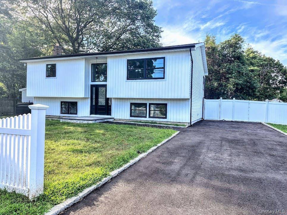 This beautifully updated high ranch offers modern living with attention to detail and style.