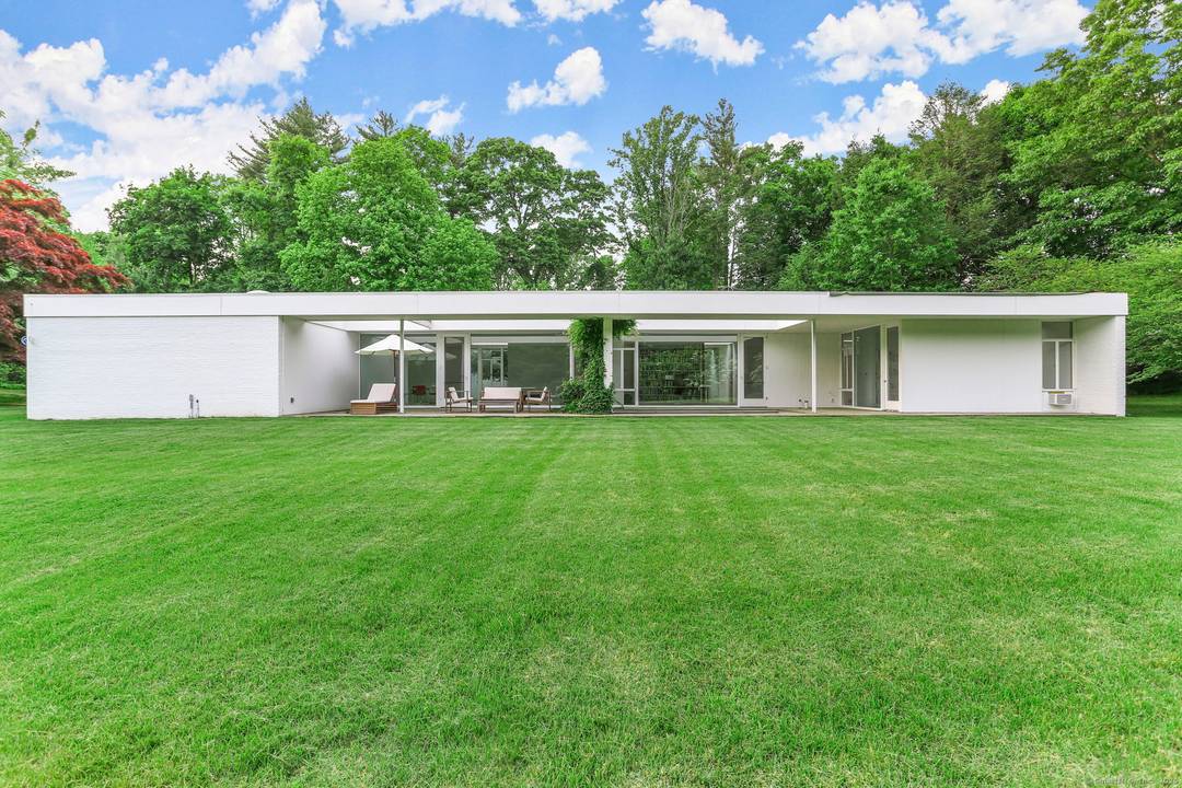 Summer furnished rental. An incredibly rare opportunity to reside in a mid century modern home designed by world renowned Harvard Five Architect, Eliot Noyes.