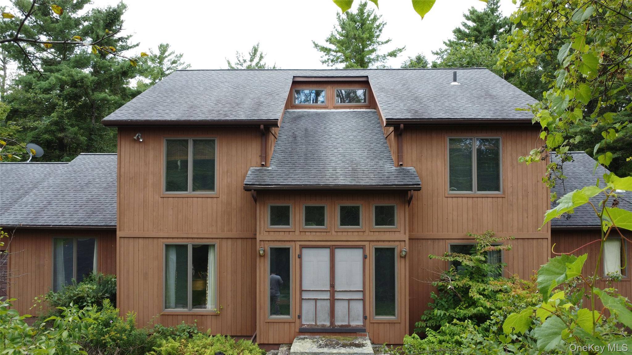 Smell the cedar ! A stunning contemporary residence on a tree lined cul de sac in the heart of Greenville, NY.