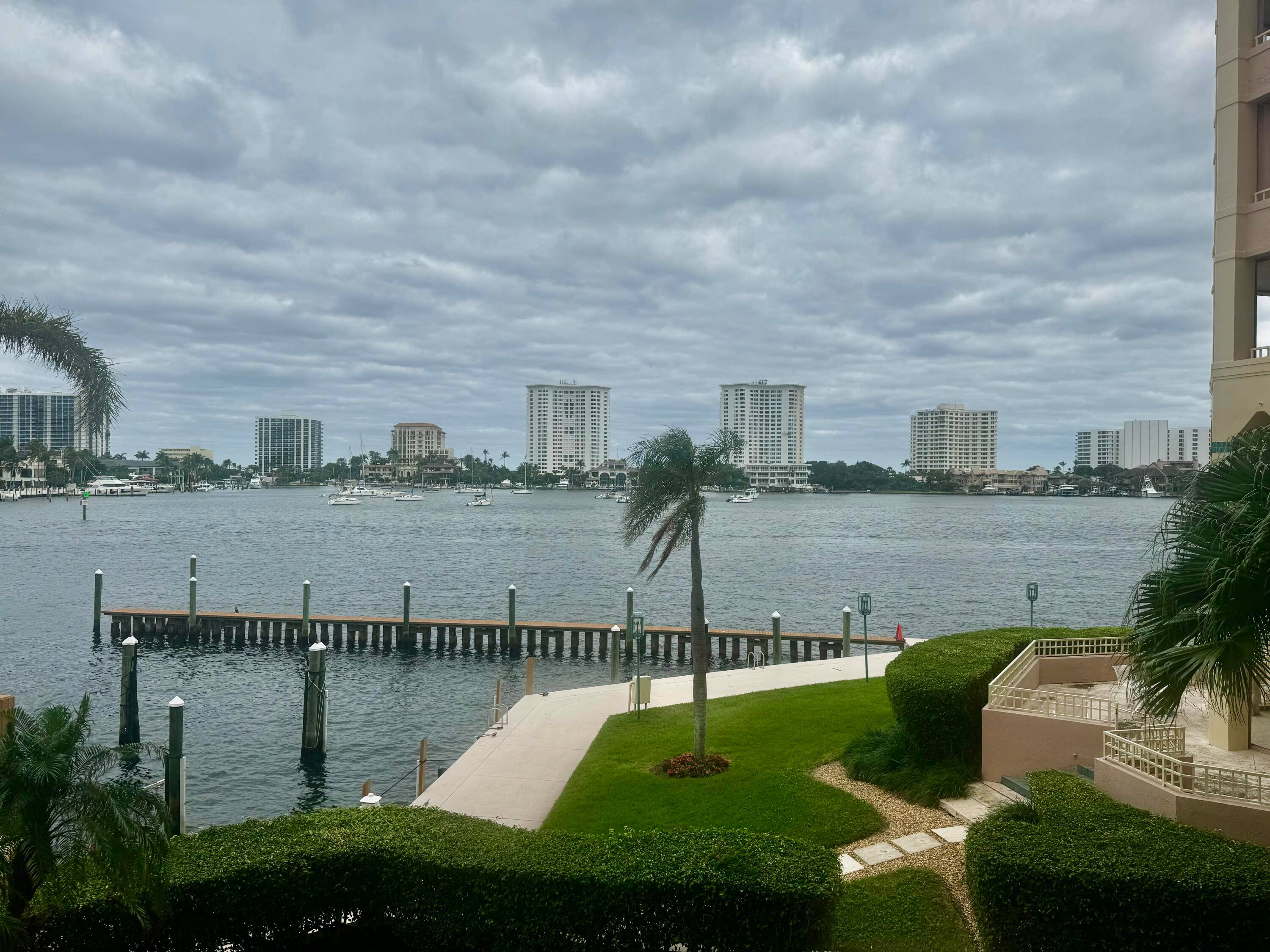 Highly coveted waterfront condo directly on Lake Boca Raton, with unique open railing on 2nd floor affording panoramic views of the pools, boat slips, and Intracoastal waterway.