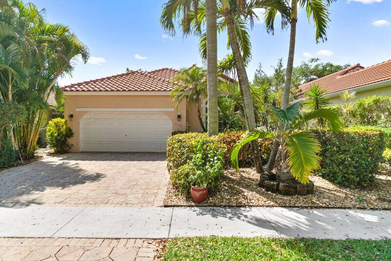 Situated in the desirable, gated community of Brookside at Indian Spring, this lovely home is drenched in natural sun light.