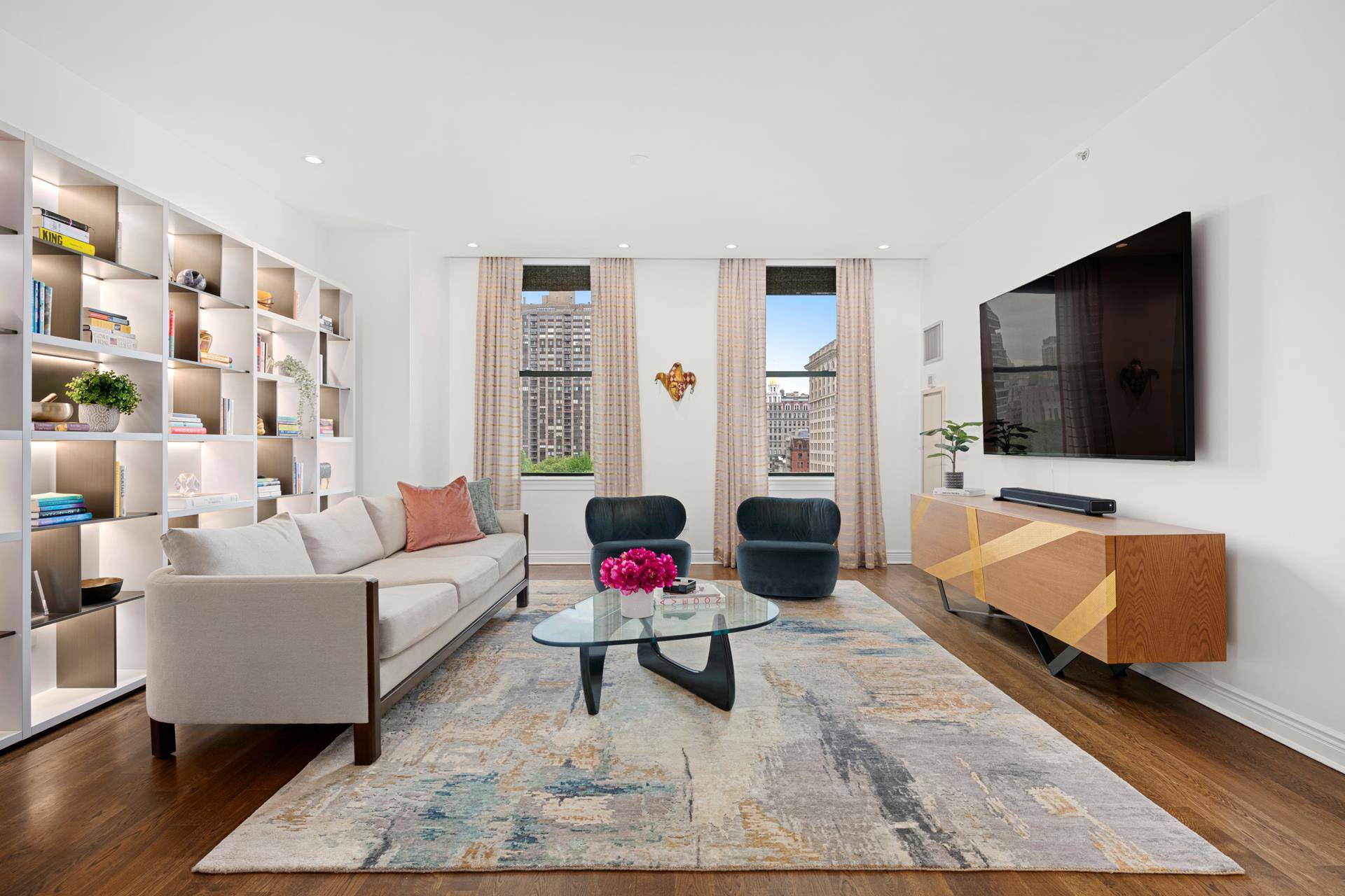 Experience luxury living at its finest in this museum quality two bedroom, two bathroom condominium in the heart of Flatiron with breathtaking front row views of Madison Square Park.