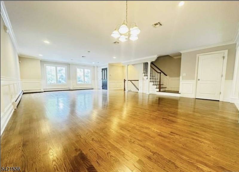 Beautiful and spacious 3 bedroom, 3 1 2 bath town home with hardwood floors throughout.