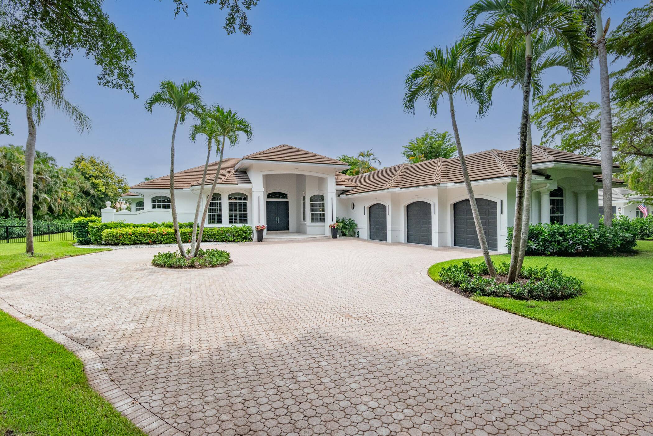 Stunning renovated one story home in Palm Beach Gardens on an acre lot in the gated community of Steeplechase.