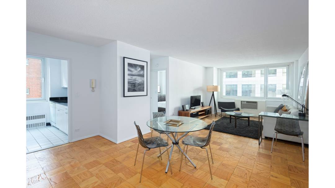 Expansive split two bedroom two bathroom apartment with windowed bathrooms and a PRIVATE BALCONY located in a full service luxury building in Midtown West.