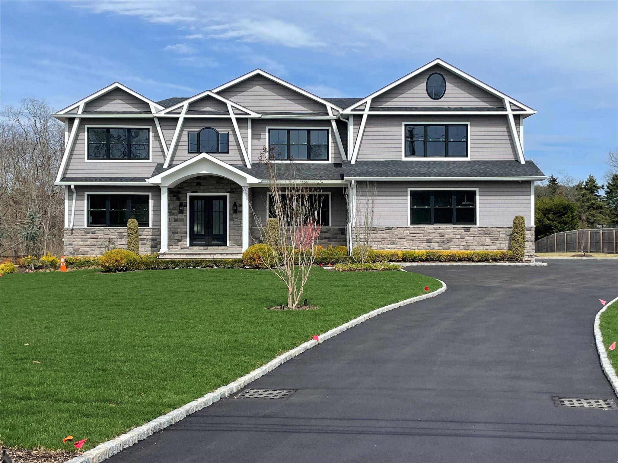 Enter This Majestic Home Through Oversized Double Doors Into A Bright Vaulted Foyer Welcomed By A Dramatic Bridal Staircase And 10 Foot First Floor Ceilings !