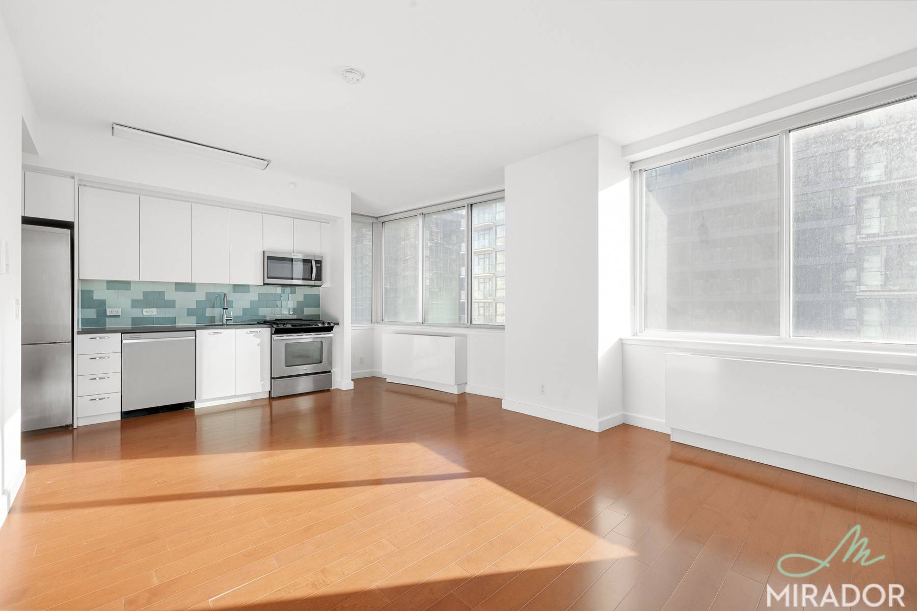 Lofty, high floor studio with tons of closets, a wall of windows, in unit laundry, and renovated kitchen with stainless steel appliances available for December.