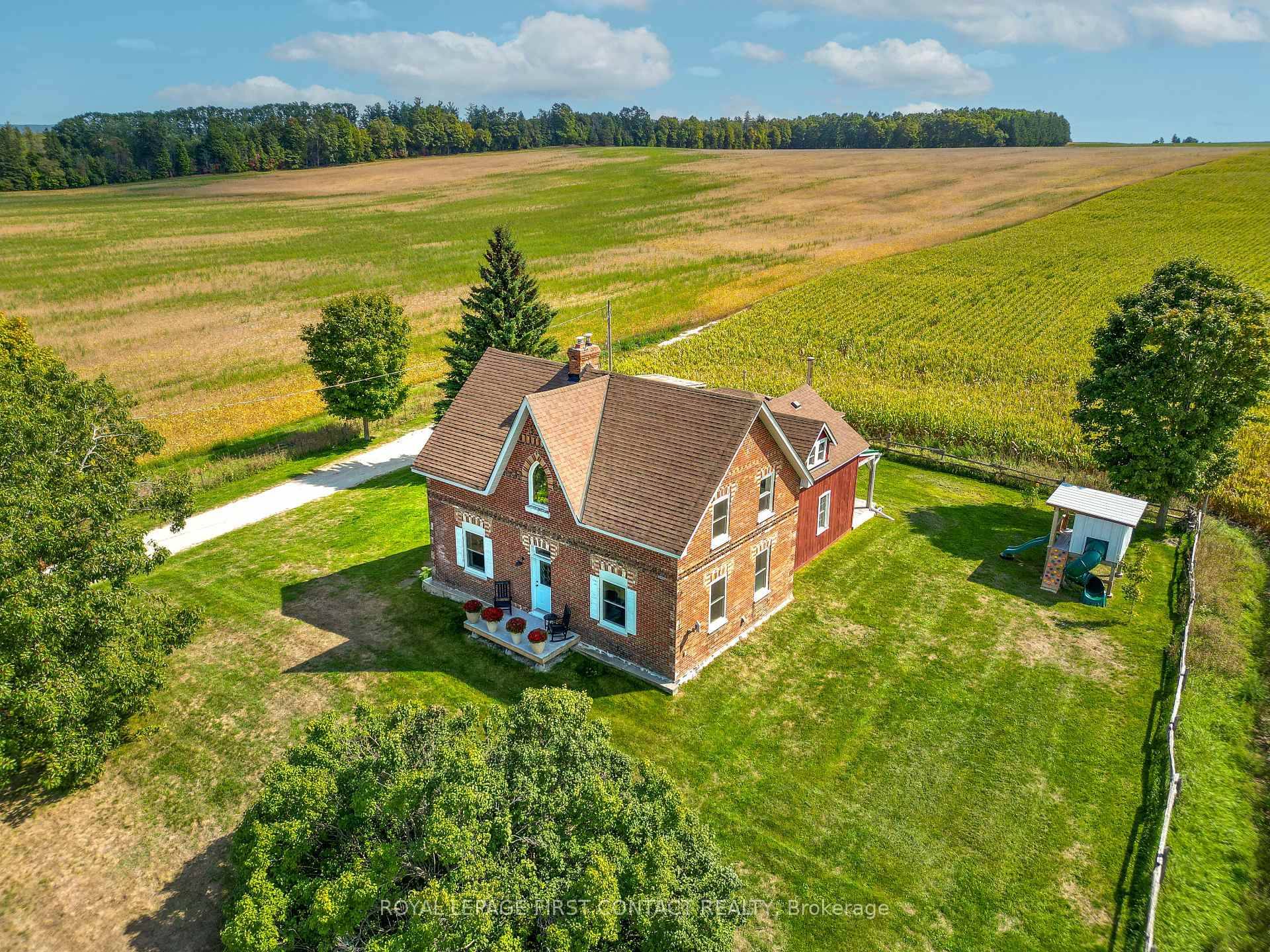 Authentic Ontario redbrick farmhouse set back on a private one acre property just 10 mins from Barrie.