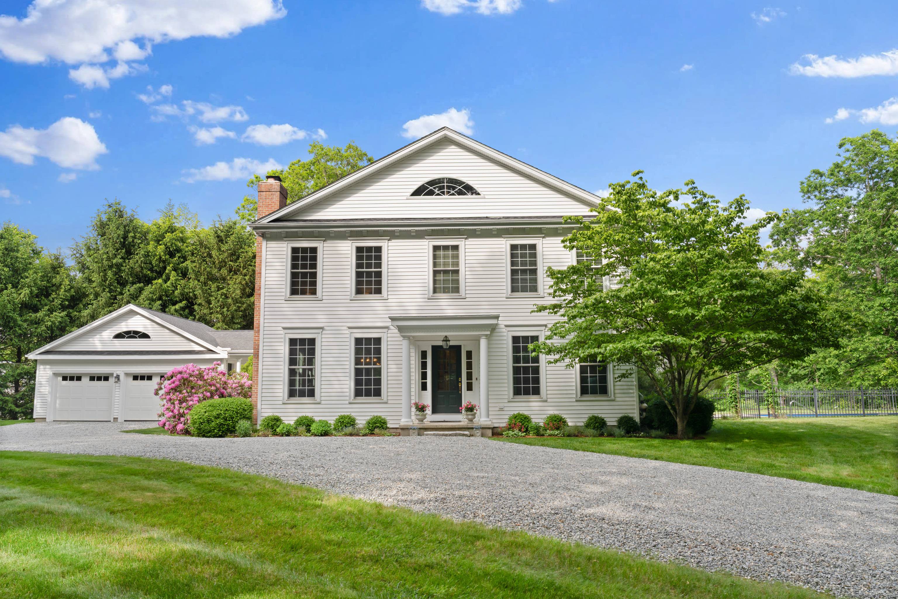 Welcome to this beautiful and spacious Federal style home, privately sited on 4.