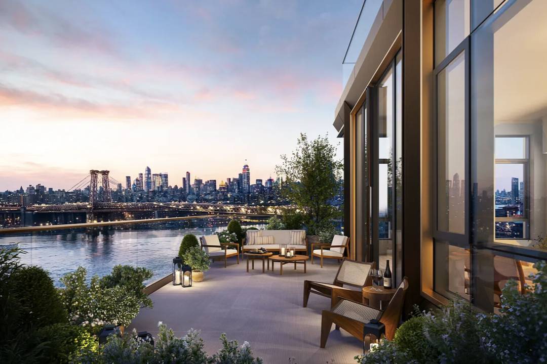 Perched at the top of One Williamsburg Wharf, this impeccably designed penthouse showcases breathtaking views of the East River and the Manhattan skyline.