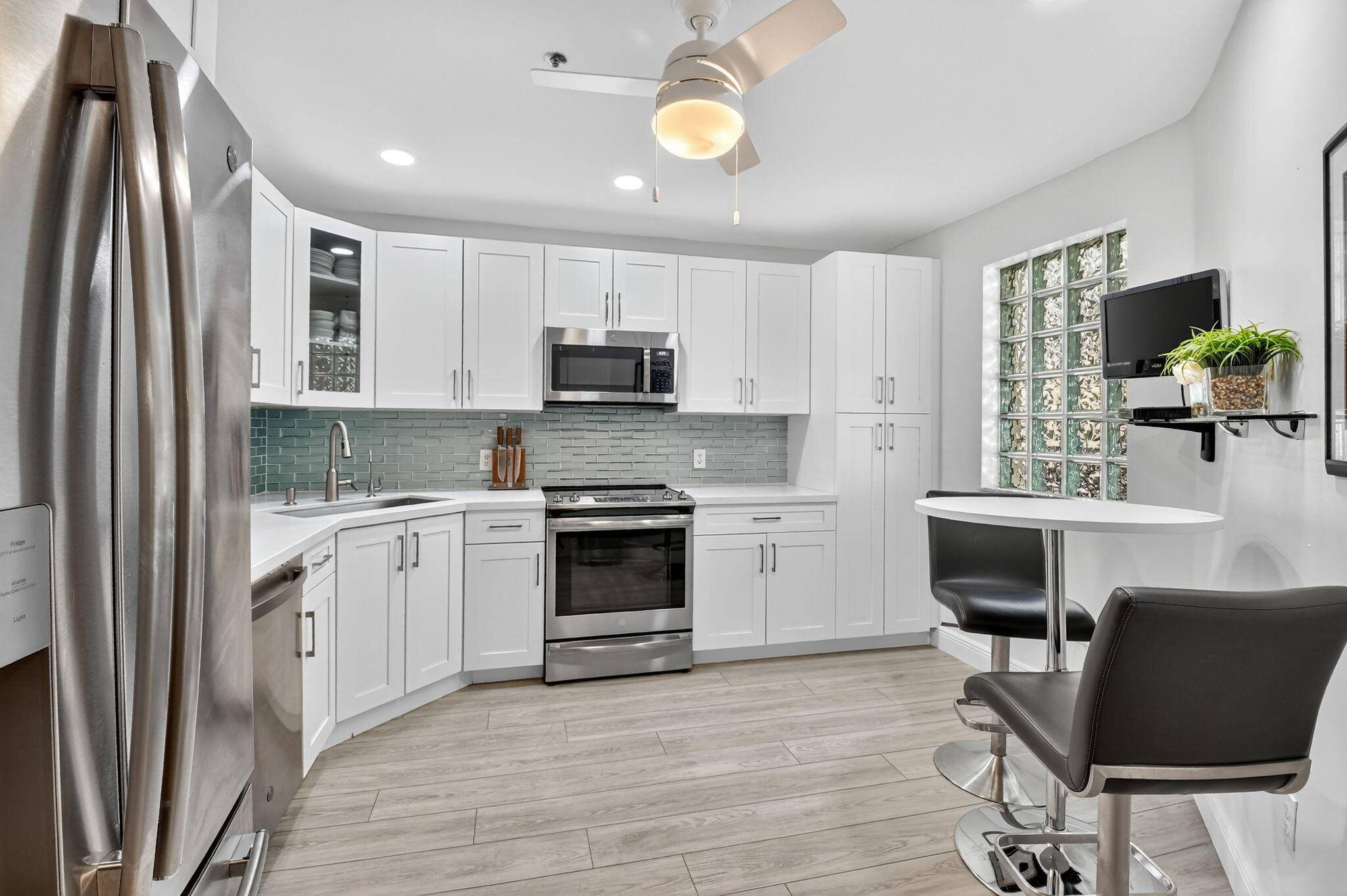 Welcome to this immaculate, fully renovated home where modern design meets resort style living.