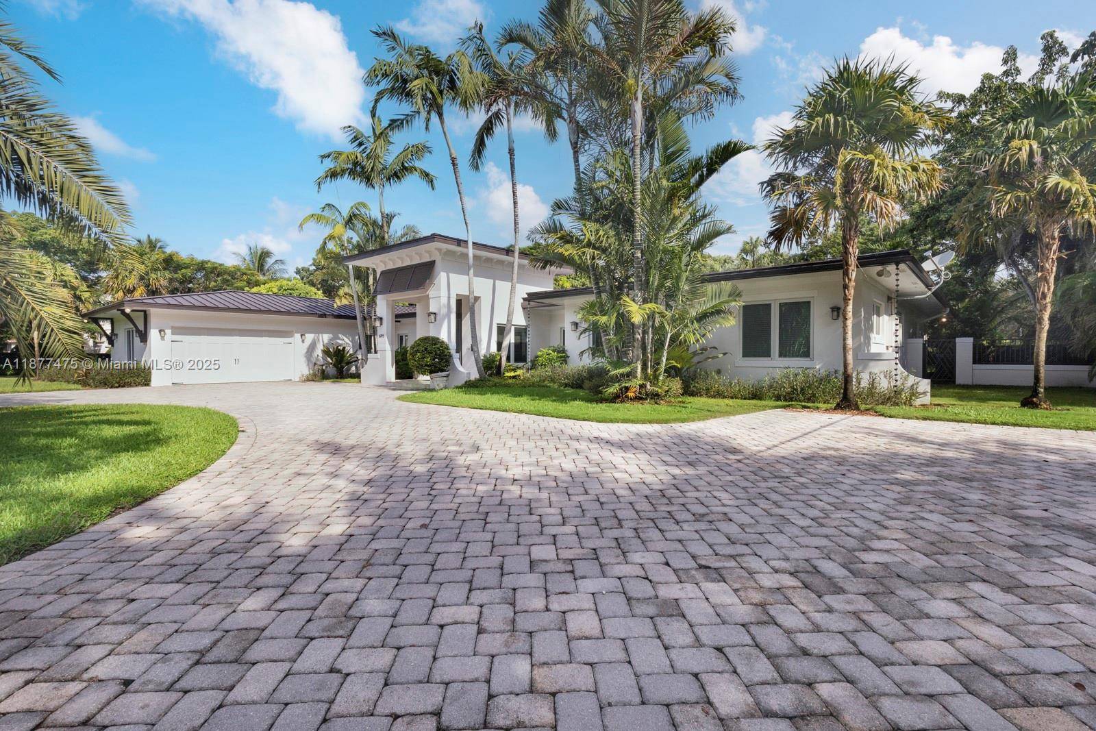 Gorgeous and fully updated Pinecrest family home situated on a picturesque 31, 700 sqft corner lot in southeast Pinecrest.
