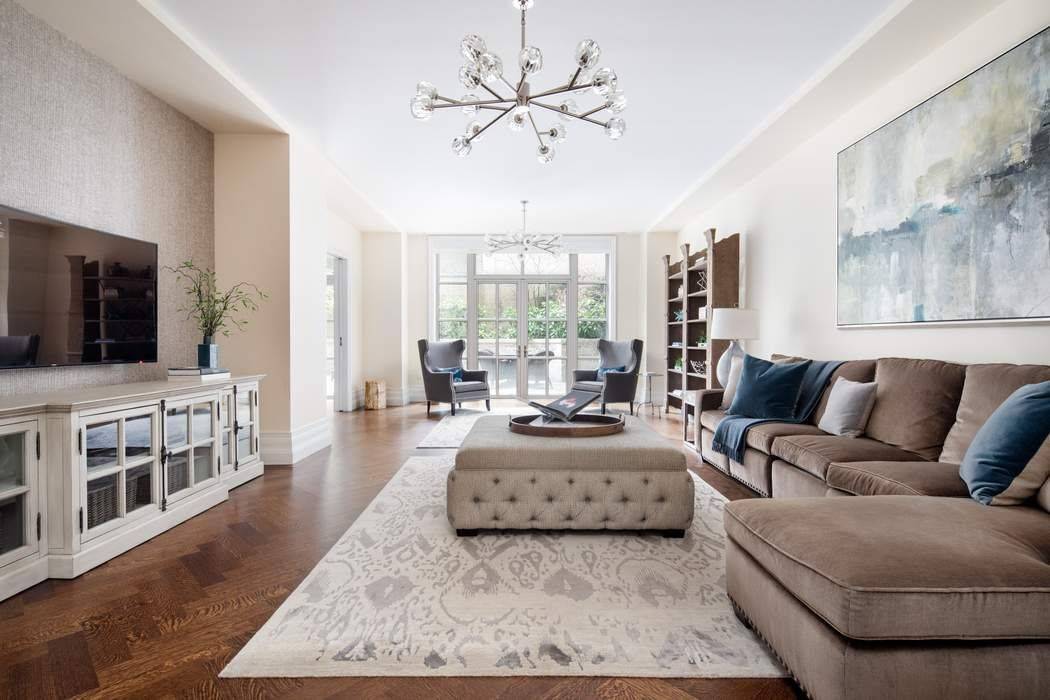 Grand Townhouse living with Condo amenities and services at the sought after 135 East 79th St Condominium.