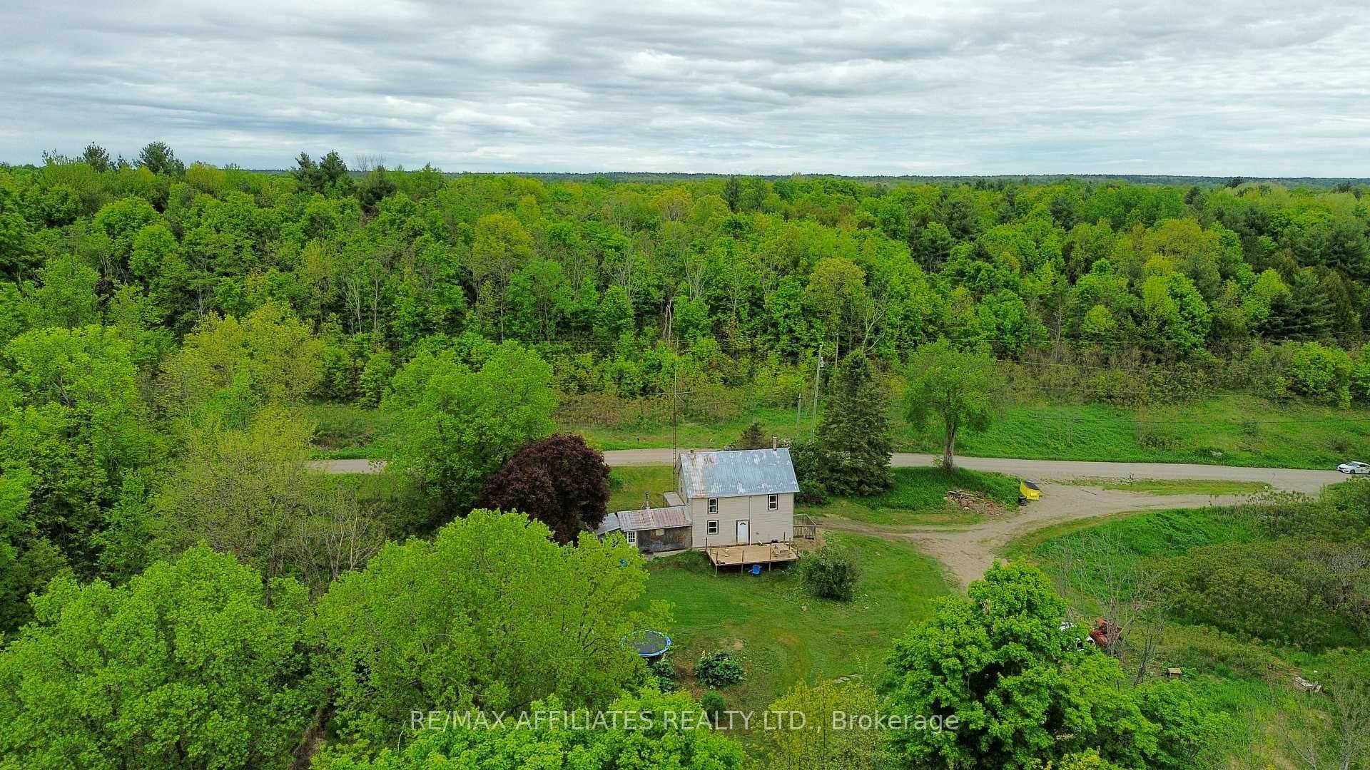 Tucked away on a quiet municipally maintained road, this 3 bedroom, 1 bathroom home sits on a sprawling 3.