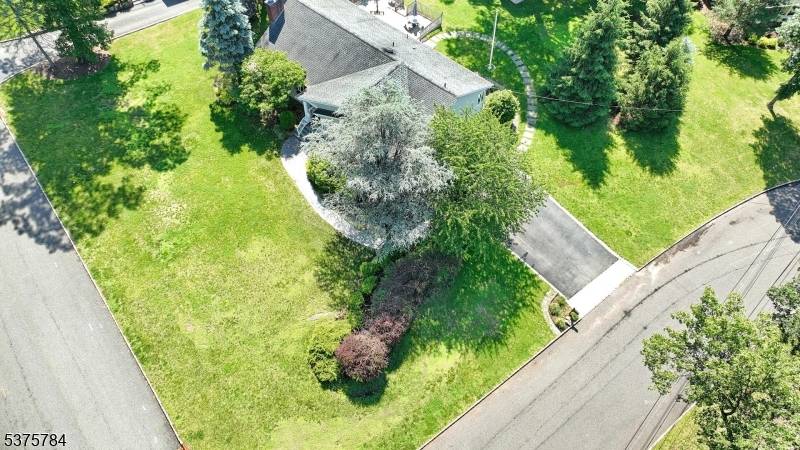 Welcome to 38 Deer Trail Road a large Corner property in the desirable Tall Timbers section of North Caldwell !