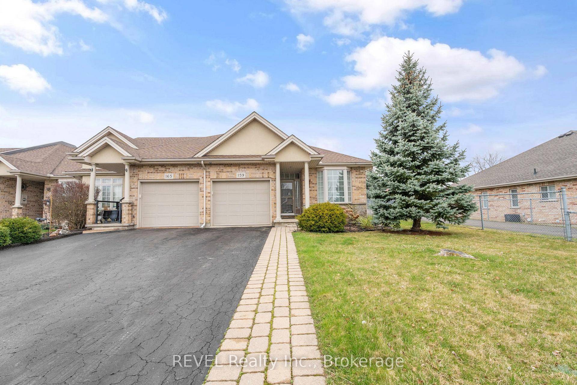 Tucked away on a peaceful dead end street, this beautifully maintained bungalow style end unit townhome offers stylish comfort and practical convenience in an ideal location.