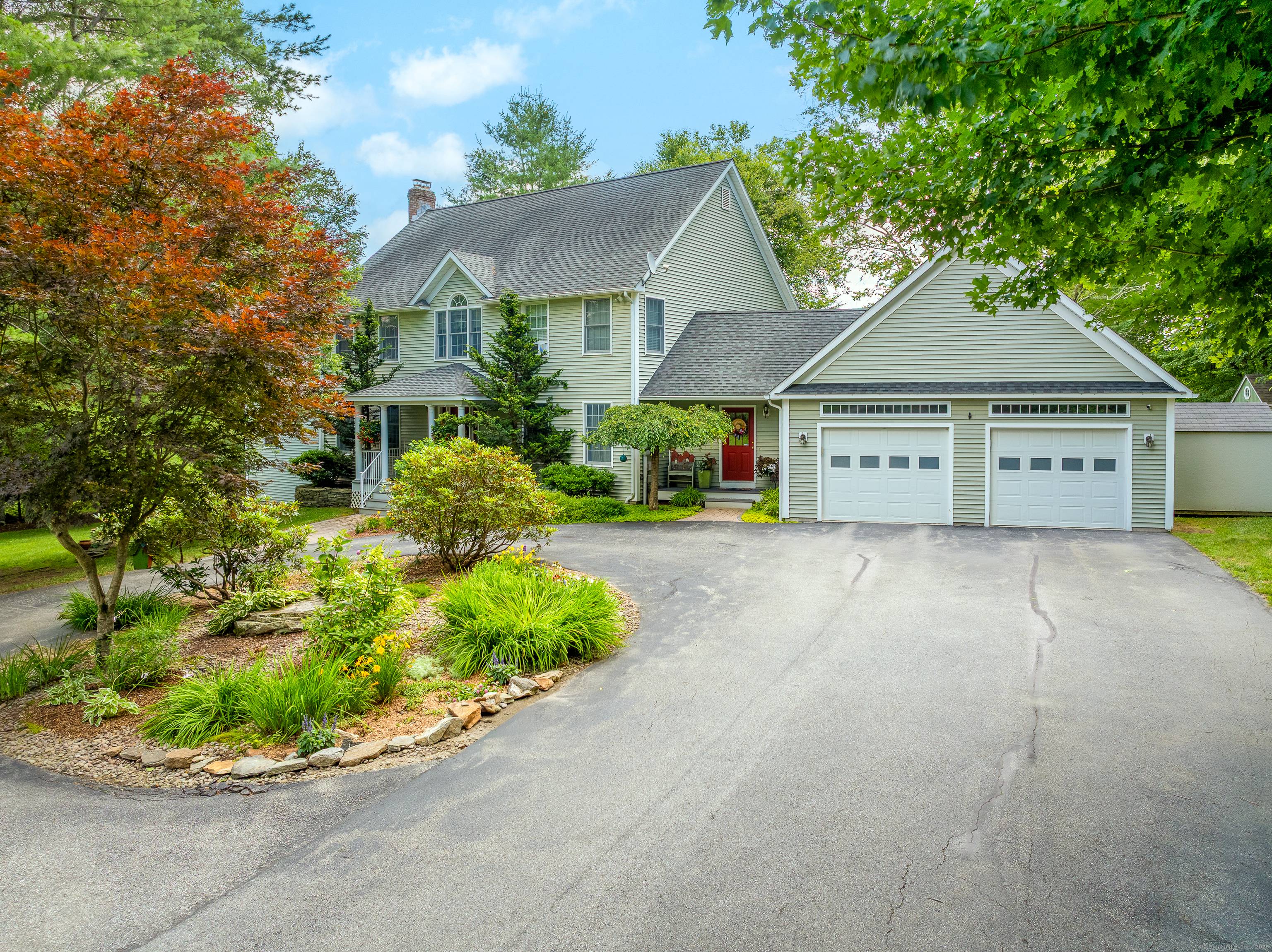 Experience refined New England living in this remarkable Colonial, set on a private, professionally landscaped lot with sweeping panoramic views in Brooklyn's coveted Quiet Corner.