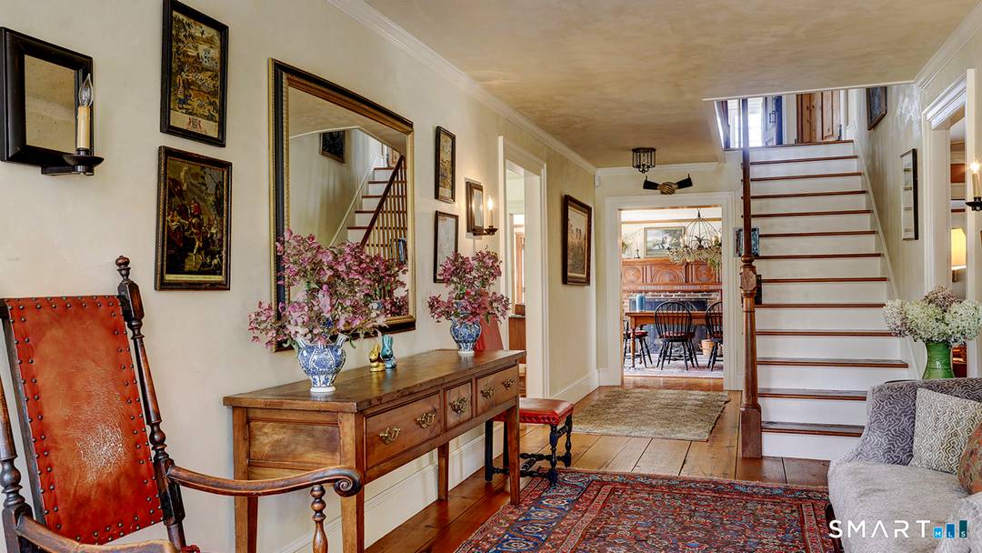 Corner house is a magnificent 1790 Center Hall Colonial with its 2 car detached garage barn and beautifully landscaped saltwater pool on a total of 15.