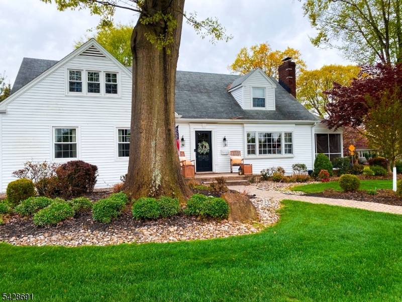This distinctive custom oversized Cape Cod blends timeless charm with thoughtful modern upgrades across four bedrooms and two full baths.