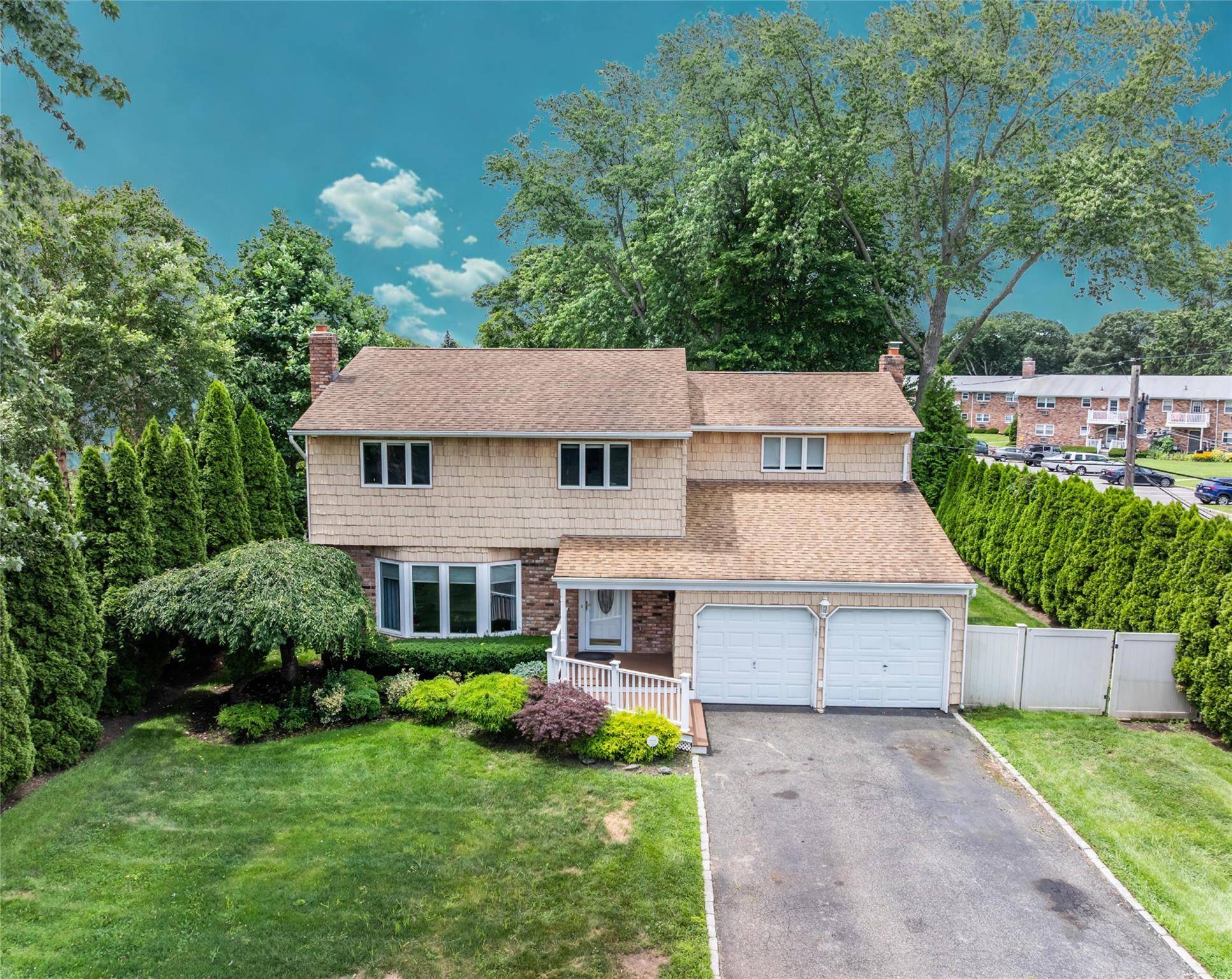 Welcome to 50 Wildwood Ave a beautifully maintained Colonial in the award winning Half Hollow Hills School District !