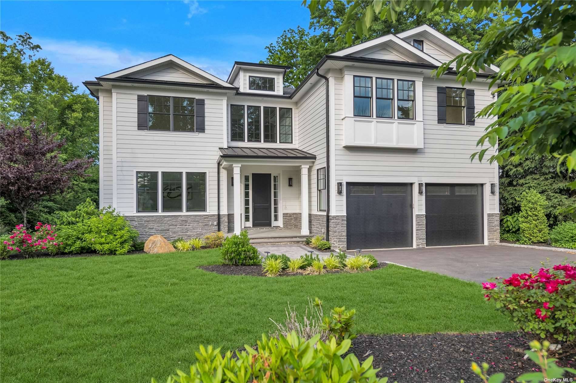 Raising the bar for quality and style in new construction, 130A Plandome Court is sited on a generous.