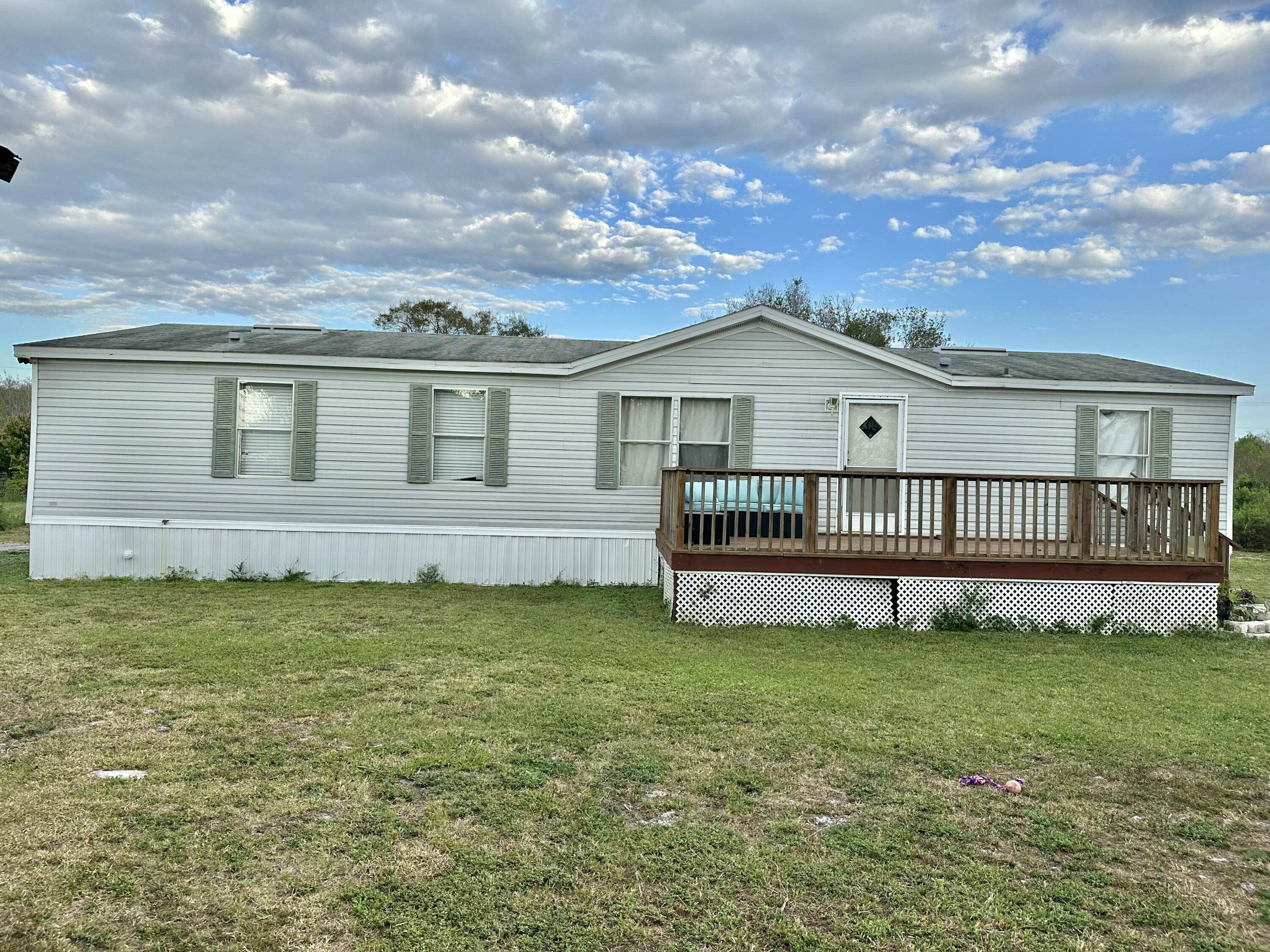 OTTER CREEK 3 2 Double Wide Mobile Home with a split floor plan and additional office space.